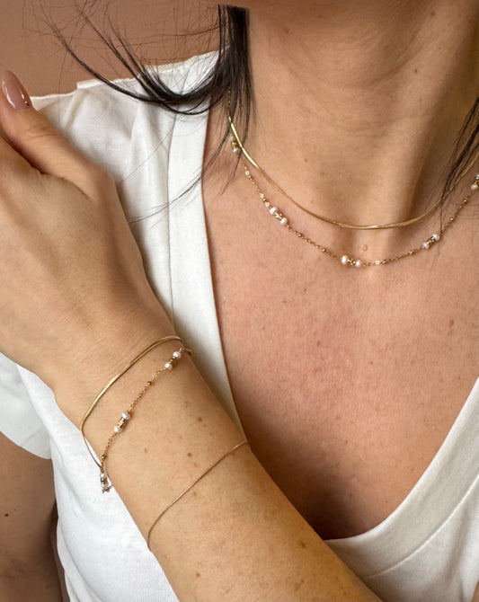 Girocollo scia dorata con perle